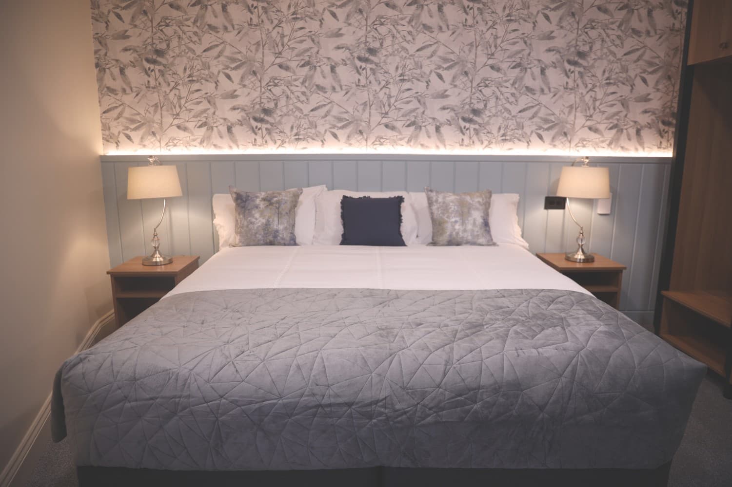 Standard Double Room with botanical wallpaper and king bed